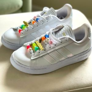 Womens adidas size 7 sneakers with beaded laces.
